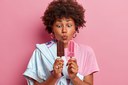 photo-funny-teenage-girl-keeps-lips-rounded-looks-appetizing-ice-cream-enjoys-summer-time-likes-cold-dessert-dressed-stylish-outfit-chooses-chocolate-strawberry-flavor.jpg